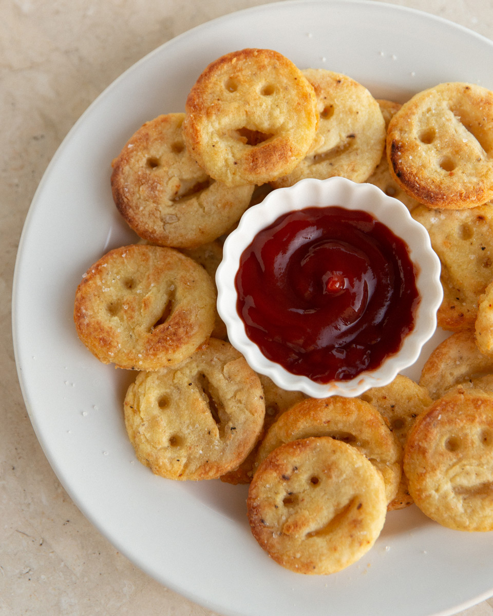 A plate of delicious homemade healthy smiley fries with ketchup