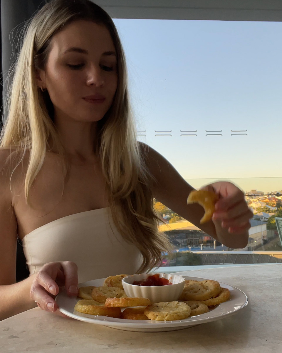 enjoying a plate of healthy baked smiley fries