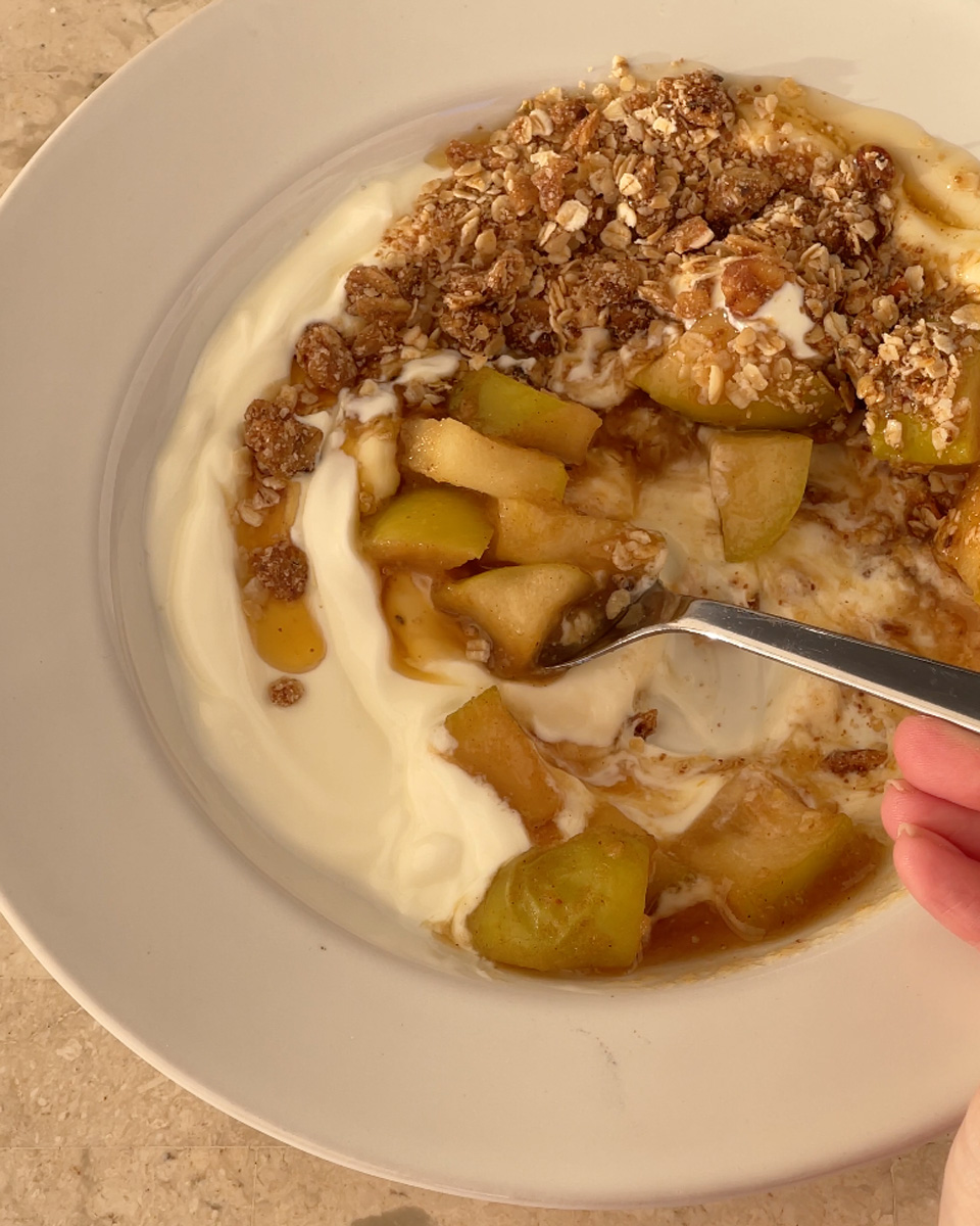 scoop of apple crumble granola bowl