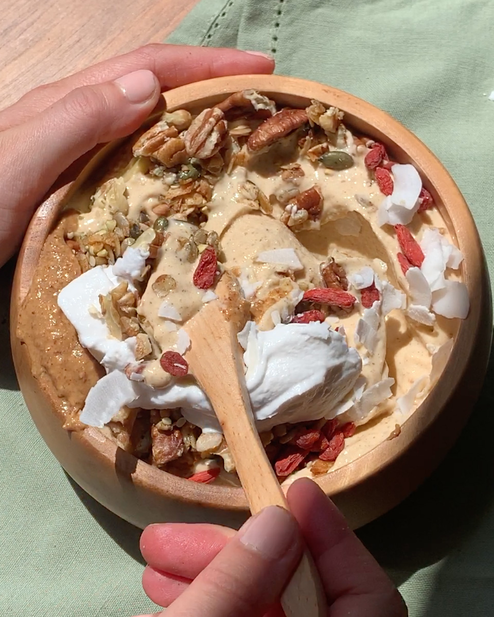 A spoonful of a pumpkin spice smoothie bowl